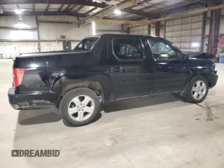 2010 Honda Ridgeline RTL with VIN 5FPYK1F5XAB011944, listed as a Copart auction lot 52434175 with 137,585 mi miles and Salvage title. Bid and sale history available at DreamBid. Image 3.