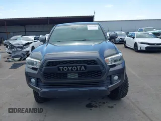 2019 Toyota Tacoma SR with VIN 3TMCZ5AN3KM207783, listed as a IAAI auction lot 42375280 with 55,784 mi miles and . Bid and sale history available at DreamBid. Image 13.