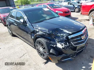 2015 Cadillac ATS Standard RWD with VIN 1G6AA5RX6F0100825, listed as a IAAI auction lot 42064997 with 143,931 mi miles and . Bid and sale history available at DreamBid. Image 1.