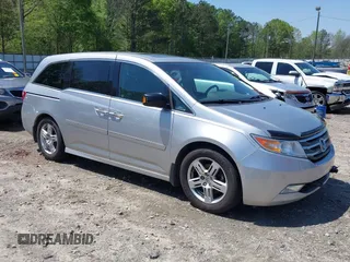 2012 Honda Odyssey Touring with VIN 5FNRL5H96CB043939, listed as a IAAI auction lot 41983643 with 202,535 mi miles. Bid and sale history available at carsss.com. Image 1.