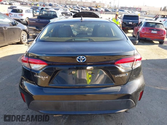 2021 Toyota Corolla Hybrid LE with VIN JTDEAMDE5MJ014959, listed as a IAAI auction lot 41751203 with 26,220 mi miles. Bid and sale history available at carsss.com. Image 16.