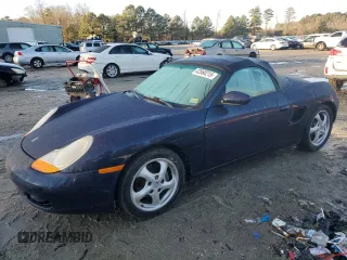 2000 Porsche Boxster z VIN WP0CA2981YU620536, wystawiony jako Copart lot #42560215 z przebiegiem 142 635 mil mil oraz Tytuł czysty. Historia ofert i sprzedaży dostępna na DreamBid. Obrazek 1.