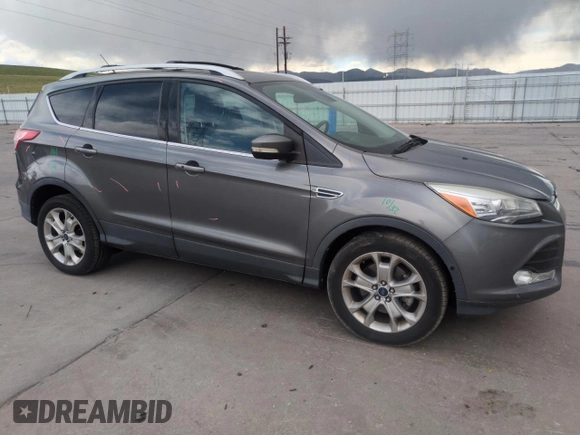 2014 Ford Escape Titanium with VIN 1FMCU9J97EUB30467, listed as a Copart auction lot 54949035 with 112,013 mi miles and Salvage Title. Bid and sale history available at DreamBid. Image 4.