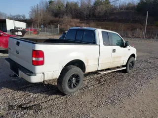 2005 Ford F-150 STX with VIN 1FTRX14W15NB34372, listed as a IAAI auction lot 41660412 with 104,086 mi miles. Bid and sale history available at carsss.com. Image 4.