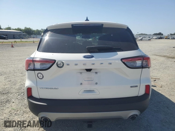 2020 Ford Escape Titanium Hybrid z VIN 1FMCU9DZ6LUC47658, wystawiony jako Copart lot #59599995 z przebiegiem 63 004 mil mil oraz Szkoda całkowita • Salvage title. Historia ofert i sprzedaży dostępna na DreamBid. Obrazek 6.