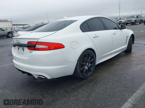 2015 Jaguar XF V6 Portfolio with VIN SAJWA0F70F8U62534, listed as a IAAI auction lot 41521097 with 112,117 mi miles. Bid and sale history available at carsss.com. Image 4.