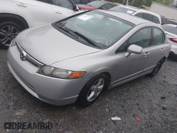 2006 Honda Civic LX with VIN 2HGFA16556H520894, listed as a IAAI auction lot 41963736 with 166,682 mi miles and . Bid and sale history available at DreamBid. Image 17.