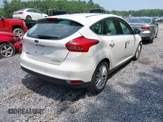 2016 Ford Focus Titanium with VIN 1FADP3N26GL332709, listed as a IAAI auction lot 42458997 with 75,509 mi miles and . Bid and sale history available at DreamBid. Image 4.