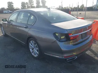 2018 BMW 7 Series 740i with VIN WBA7E2C55JB214987, listed as a IAAI auction lot 41733790 with 96,738 mi miles. Bid and sale history available at carsss.com. Image 3.