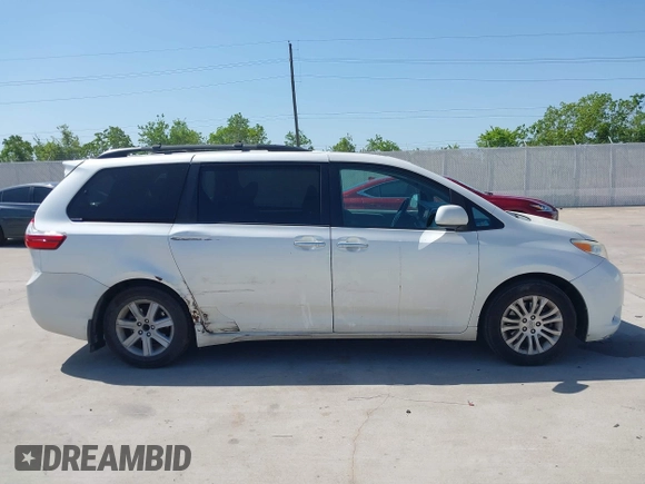 2015 Toyota Sienna XLE with VIN 5TDYK3DCXFS663083, listed as a IAAI auction lot 41967621 with 177,472 mi miles and . Bid and sale history available at DreamBid. Image 13.