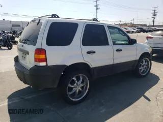 2006 Ford Escape XLS with VIN 1FMCU02Z36KA71926, listed as a Copart auction lot 57697364 with 225,212 mi miles and Salvage title. Bid and sale history available at DreamBid. Image 3.