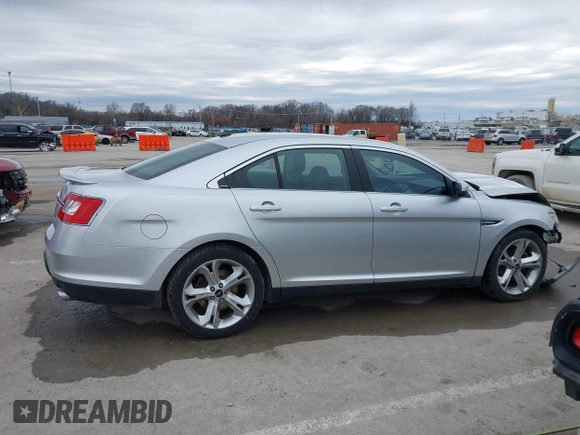 2012 Ford Taurus SHO z VIN 1FAHP2KT6CG142954, wystawiony jako IAAI lot #41526760 z przebiegiem 187 887 mil mil oraz . Historia ofert i sprzedaży dostępna na DreamBid. Obrazek 13.