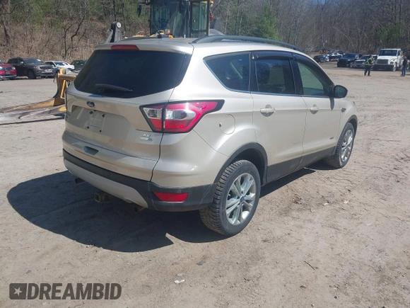 2017 Ford Escape SE with VIN 1FMCU9GD1HUD23228, listed as a IAAI auction lot 42074213 with 115,757 mi miles. Bid and sale history available at carsss.com. Image 4.