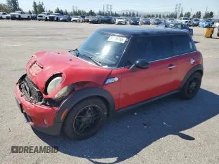 2009 MINI Hardtop S with VIN WMWMF73529TW87085, listed as a Copart auction lot 56516745 with 128,576 mi miles and Salvage title. Bid and sale history available at DreamBid. Image 1.