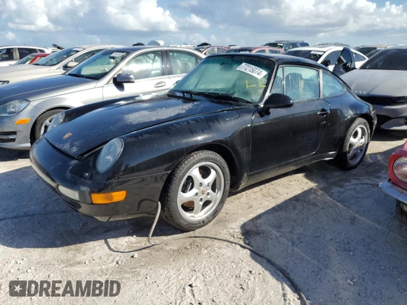 1995 Porsche 911 Carrera with VIN WP0AA2990SS323244, listed as a Copart auction lot 77215074 with 0 mi miles and Non Repairable. Bid and sale history available at carsss.com. Image 1.