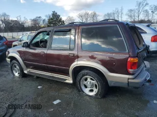 2000 Ford Explorer Eddie Bauer z VIN 1FMZU74E6YUB37521, wystawiony jako Copart lot #85994294 z przebiegiem 126 348 mil mil oraz Szkoda całkowita • Salvage title. Historia ofert i sprzedaży dostępna na DreamBid. Obrazek 2.