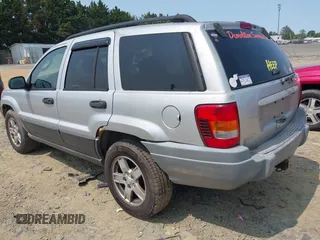2003 Jeep Grand Cherokee Laredo with VIN 1J4GW48S83C558962, listed as a IAAI auction lot 42415803 with 312,419 mi miles and . Bid and sale history available at DreamBid. Image 3.