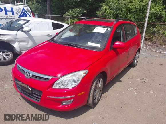 2010 Hyundai Elantra Touring SE with VIN KMHDC8AE2AU075841, listed as a IAAI auction lot 40128211 with 173,541 mi miles. Bid and sale history available at carsss.com. Image 2.
