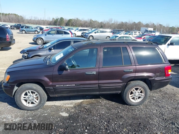 2004 Jeep Grand Cherokee with VIN 1J8GX48S24C266933, listed as a IAAI auction lot 41497122 with 200,899 mi miles and . Bid and sale history available at DreamBid. Image 14.