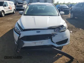 2017 Ford Focus SE with VIN 1FADP3F26HL313478, listed as a Copart auction lot 57078015 with 56,807 mi miles and Salvage title. Bid and sale history available at DreamBid. Image 5.