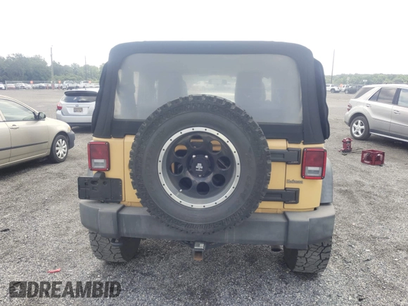 2013 Jeep Wrangler Sport with VIN 1C4AJWAG1DL672816, listed as a IAAI auction lot 42597238 with 105,910 mi miles and . Bid and sale history available at DreamBid. Image 16.