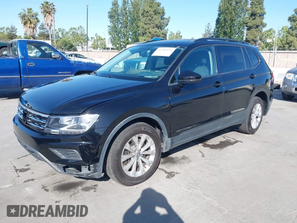 2018 Volkswagen Tiguan S with VIN 3VV1B7AX1JM091928, listed as a IAAI auction lot 42283454 with 53,650 mi miles and . Bid and sale history available at DreamBid. Image 17.