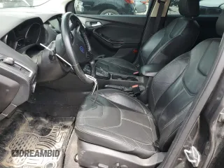 2015 Ford Focus Titanium z VIN 1FADP3N2XFL357224, wystawiony jako Copart lot #55626575 z przebiegiem 159 422 mil mil oraz Szkoda całkowita • Salvage title. Historia ofert i sprzedaży dostępna na DreamBid. Obrazek 7.