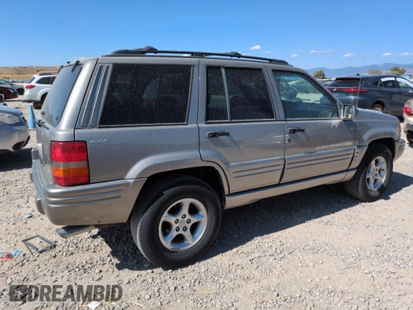 1998 Jeep Grand Cherokee Limited z VIN 1J4GZ88Z8WC306919, wystawiony jako Copart lot #61505725 z przebiegiem 195 329 mil mil oraz Czysty tytuł • Clean title. Historia ofert i sprzedaży dostępna na DreamBid. Obrazek 3.