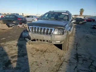 1999 Jeep Grand Cherokee Laredo with VIN 1J4GW58NXXC747537, listed as a Copart auction lot 87310234 with 0 mi miles and Salvage Title. Bid and sale history available at carsss.com. Image 10.
