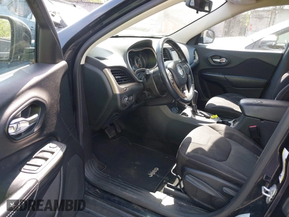 2015 Jeep Cherokee Latitude with VIN 1C4PJLCB9FW627909, listed as a IAAI auction lot 42034667 with 131,739 mi miles and . Bid and sale history available at carsss.com. Image 19.