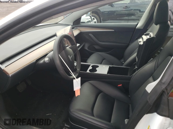 2023 Tesla Model 3 with VIN 5YJ3E1EA6PF563331, listed as a Copart auction lot 61124715 with 26,198 mi miles and Salvage title. Bid and sale history available at DreamBid. Image 7.