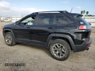 2022 Jeep Cherokee Trailhawk with VIN 1C4PJMBX8ND554044, listed as a Copart auction lot 82687464 with 13,353 mi miles and Salvage Title. Bid and sale history available at carsss.com. Image 2.