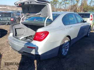 2014 BMW 7 Series 740i with VIN WBAYA6C54ED144450, listed as a IAAI auction lot 41680060 with 999,999 mi miles. Bid and sale history available at carsss.com. Image 4.