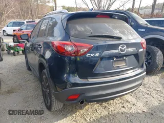 2016 Mazda CX-5 Grand Touring with VIN JM3KE2DY1G0708572, listed as a IAAI auction lot 41685298 with 109,427 mi miles. Bid and sale history available at carsss.com. Image 3.
