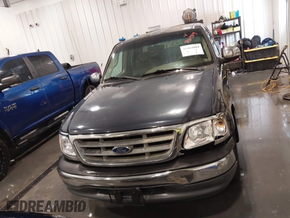 2001 Ford F-150 XL z VIN 1FTRX17L61NB44147, wystawiony jako IAAI lot #41464804 z przebiegiem 130 860 mil mil oraz . Historia ofert i sprzedaży dostępna na DreamBid. Obrazek 13.