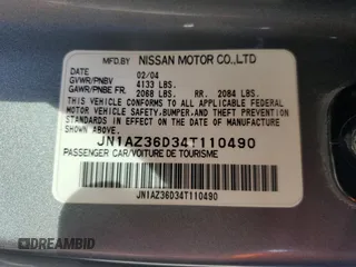 2004 Nissan 350Z Enthusiast z VIN JN1AZ36D34T110490, wystawiony jako Copart lot #57863915 z przebiegiem 139 757 mil mil oraz Szkody całkowita. Historia ofert i sprzedaży dostępna na DreamBid. Obrazek 12.