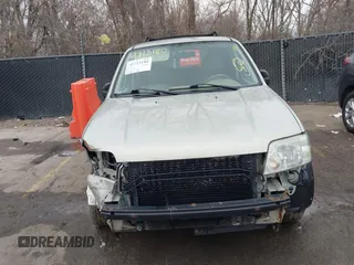 2005 Mercury Mariner Luxury z VIN 4M2YU57175DJ05986, wystawiony jako IAAI lot #41713180 z przebiegiem 243 682 mil mil oraz . Historia ofert i sprzedaży dostępna na DreamBid. Obrazek 6.