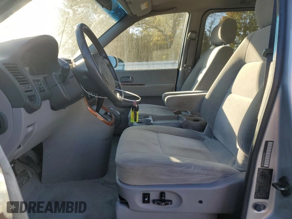 2004 Kia Sedona LX with VIN KNDUP131346508490, listed as a Copart auction lot 77391594 with 41,211 mi miles and Salvage Title. Bid and sale history available at carsss.com. Image 7.