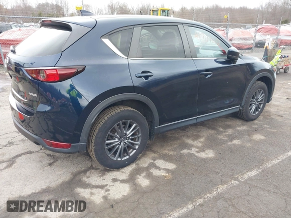 2021 Mazda CX-5 Touring with VIN JM3KFBCM7M1380396, listed as a IAAI auction lot 41707612 with 55,555 mi miles. Bid and sale history available at carsss.com. Image 4.