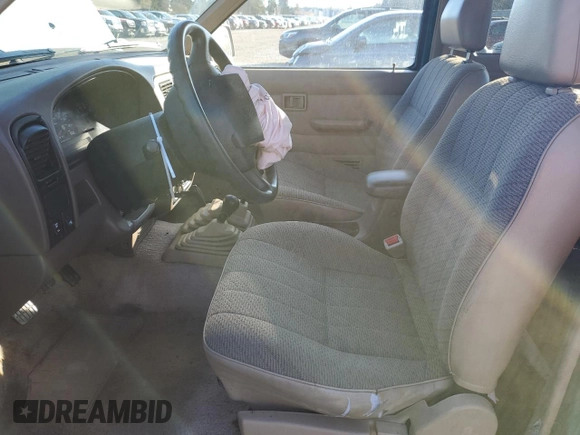 1996 Nissan Frontier XE with VIN 1N6SD16Y9TC338402, listed as a Copart auction lot 45058765 with 164,295 mi miles and Salvage title. Bid and sale history available at DreamBid. Image 7.