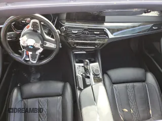 2018 BMW 5 Series M550i xDrive with VIN WBAJB9C53JB034947, listed as a Copart auction lot 77270534 with Not provided miles and Non repairable. Bid and sale history available at DreamBid. Image 8.