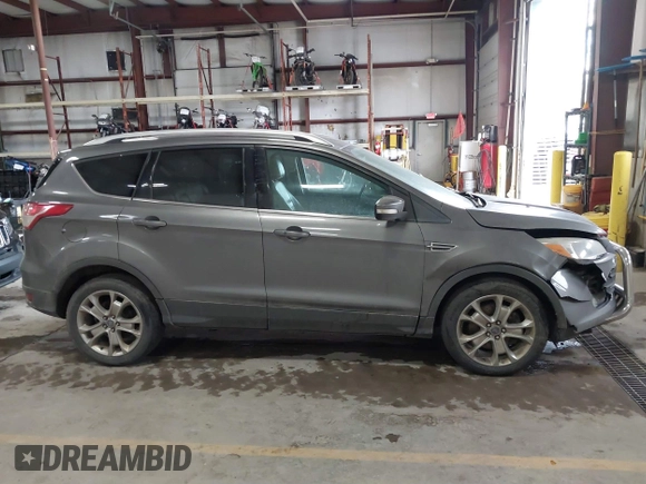 2014 Ford Escape Titanium with VIN 1FMCU9J90EUC31625, listed as a IAAI auction lot 41492075 with 301,917 mi miles and . Bid and sale history available at DreamBid. Image 13.