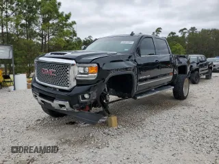 2017 GMC Sierra 2500HD Denali with VIN 1GT12UEY5HF248564, listed as a Copart auction lot 84854984 with 142,517 mi miles and Salvage title. Bid and sale history available at DreamBid. Image 1.