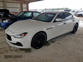 2016 Maserati Ghibli with VIN ZAM57XSA2G1175656, listed as a Copart auction lot 64033105 with 105,546 mi miles and Salvage title. Bid and sale history available at DreamBid. Image 1.
