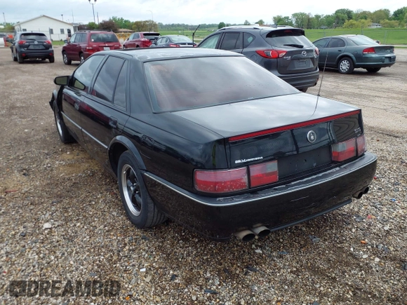1994 Cadillac Seville STS z VIN 1G6KY5296RU823387, wystawiony jako IAAI lot #42151901 z przebiegiem 165 918 mil mil oraz . Historia ofert i sprzedaży dostępna na DreamBid. Obrazek 3.