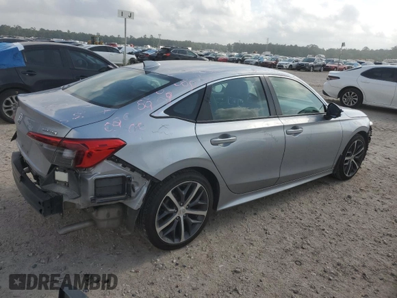 2023 Honda Civic Touring z VIN 2HGFE1F92PH323562, wystawiony jako Copart lot #54060205 z przebiegiem 20 504 mil mil oraz Czysty tytuł • Clean title. Historia ofert i sprzedaży dostępna na DreamBid. Obrazek 3.