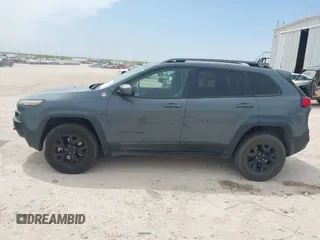 2015 Jeep Cherokee Trailhawk with VIN 1C4PJMBS0FW524479, listed as a IAAI auction lot 41908871 with 118,825 mi miles and . Bid and sale history available at DreamBid. Image 14.