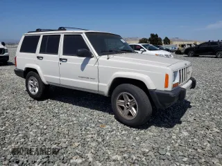 2000 Jeep Cherokee with VIN 1J4FT48S6YL152495, listed as a Copart auction lot 60627965 with 196,086 mi miles and Salvage title. Bid and sale history available at DreamBid. Image 4.