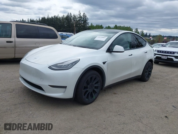 2021 Tesla Model Y Long Range with VIN 5YJYGDEE6MF082883, listed as a IAAI auction lot 42078807 with 64,953 mi miles. Bid and sale history available at carsss.com. Image 20.