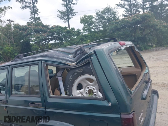 2000 Jeep Cherokee z VIN 1J4FT48S4YL265734, wystawiony jako IAAI lot #42556994 z przebiegiem 228 162 mil mil oraz . Historia ofert i sprzedaży dostępna na DreamBid. Obrazek 6.